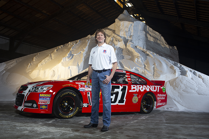 Rick Brandt with Racecar in Plant Building